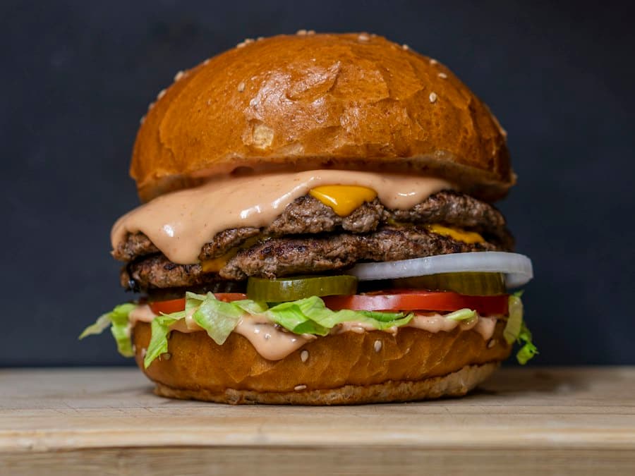 A burger with lettuce and tomato