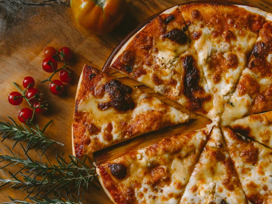 A cheese pizza with cherry tomatoes